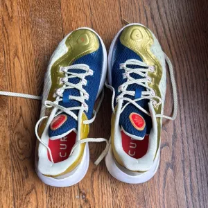 Boys under Armour Blue and Gold Curry basketball shoes