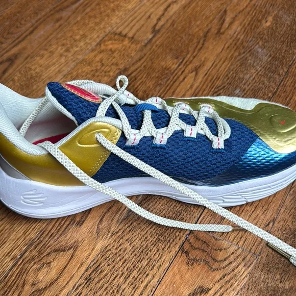 Boys under Armour Blue and Gold Curry basketball shoes