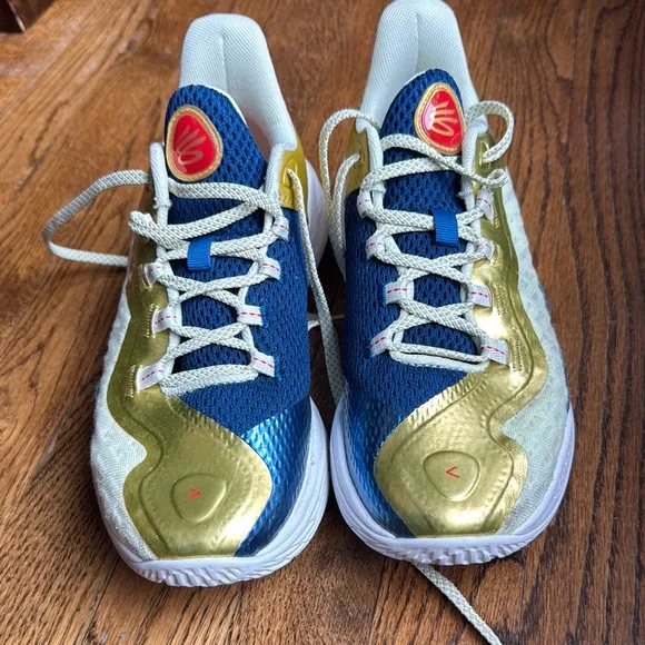 Boys under Armour Blue and Gold Curry basketball shoes
