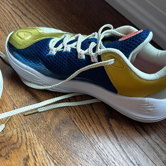 Boys under Armour Blue and Gold Curry basketball shoes